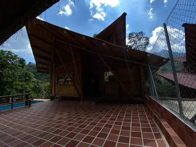 a small building with a fence around it at hermosa cabaña villa majo, cuenta con el espectacular rio santo domingo in San Francisco