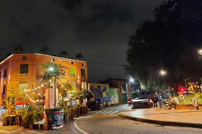 a city street at night with christmas lights at Loft Poblado Park in Medellín