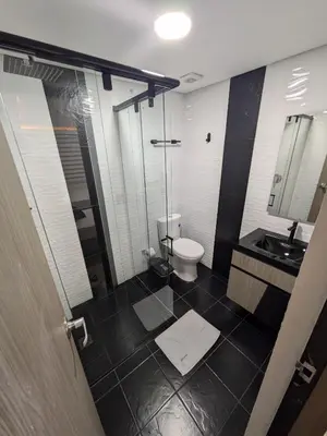 a bathroom with a toilet and a sink at Hostel Boutique Nido de Loros in Medellín