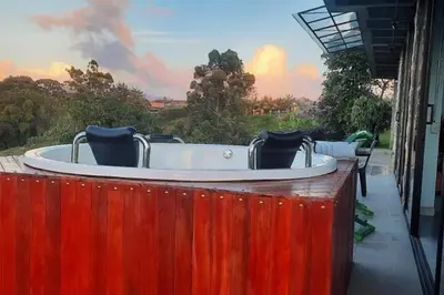 a jacuzzi tub with chairs sitting in it at Casa De Campo in Santuario