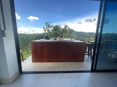 a view of a bath tub from a sliding glass door at Casa De Campo in Santuario