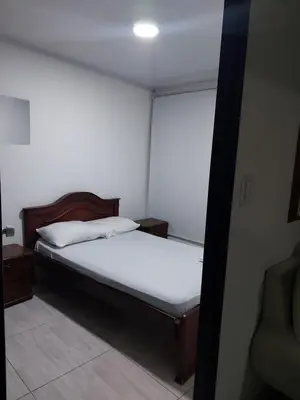 a small bedroom with a bed and a window at Apartaestudio3 Sector Cable-Estadio Mejor Ubicacion de Manizales in Manizales