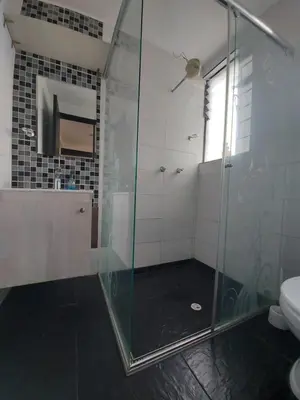 a bathroom with a glass shower and a toilet at Apartaestudio3 Sector Cable-Estadio Mejor Ubicacion de Manizales in Manizales