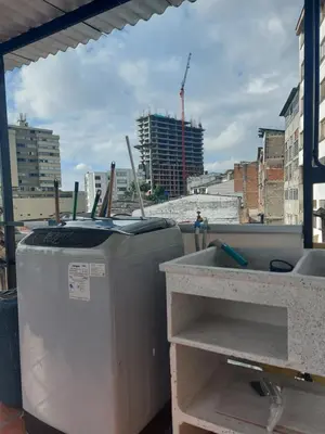 a balcony with two trash cans and a sink at Apartaestudio3 Sector Cable-Estadio Mejor Ubicacion de Manizales in Manizales