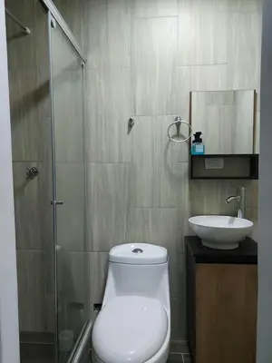 a bathroom with a toilet and a sink at Apartaestudio6 sector Cable Estadio in Manizales