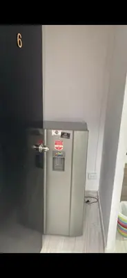 a stainless steel refrigerator in a room at Apartaestudio6 sector Cable Estadio in Manizales