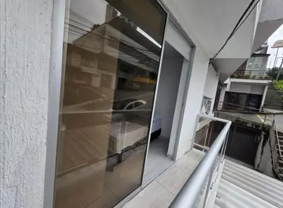 a glass door on the side of a building at Apartaestudio6 sector Cable Estadio in Manizales