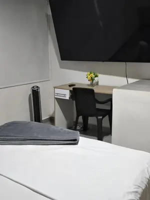 a room with a desk and a table with a chair at Apartamento Guatapé Plaza in Guatapé