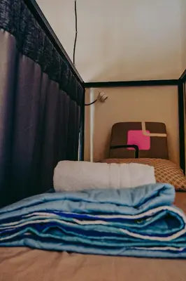 a room with a bed with a tent at Hostel Metro Floresta Alojamiento in Medellín