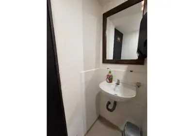 a bathroom with a sink and a mirror at Balcón Paisa SAS in Medellín