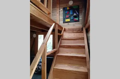 a staircase in a tiny house at La Casa En El Bosque in El Retiro