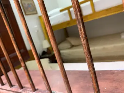 a staircase with wooden railings in a room at Casa Grande in Medellín