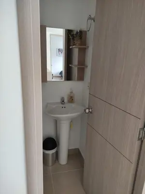 a bathroom with a sink and a mirror at Casitadisol in Santa Fe de Antioquia