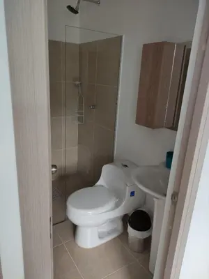 a small bathroom with a toilet and a sink at Casitadisol in Santa Fe de Antioquia