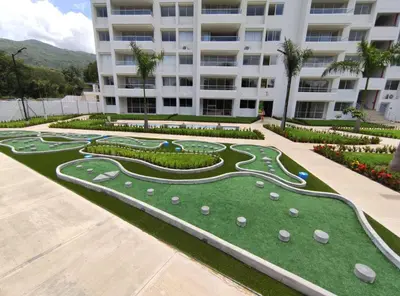 a golf course in front of a building at Casitadisol in Santa Fe de Antioquia