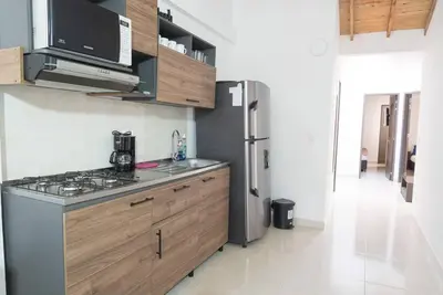 a kitchen with a stove and a refrigerator at El EmAnJe 1 in Jardin