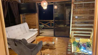 a living room with a white couch and a tv at Mi lugar secreto in Medellín