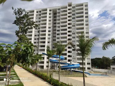 a large building with a blue plane in front of it at Apartasol Citadela Di Sole 1104 - Santafé de Antioquia in Santa Fe de Antioquia