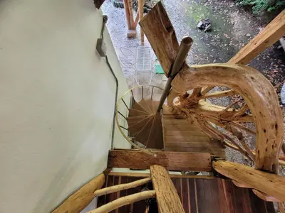 an overhead view of a wooden spiral staircase at Refugio en el Bosque in Medellín