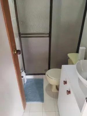 a bathroom with a shower and a toilet and a sink at Casa 4 in Medellín