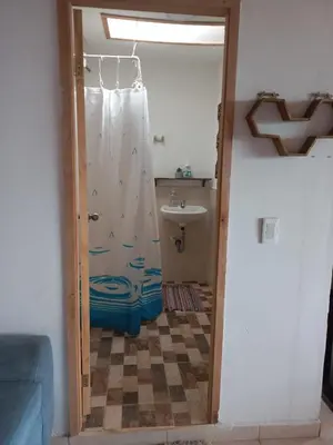 a bathroom with a shower and a sink at Cabaña Noche De Luna in Jardin