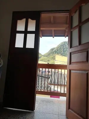 an open door with a view of a balcony at dulce estancia in Jardin