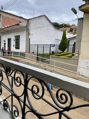 a view from a balcony of a house with a fence at Del Rocío Alojamiento -ANDES in Los Andes