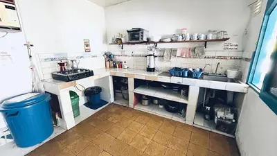 a kitchen with a sink and a counter top at Parcerito's Hostel in Jericó