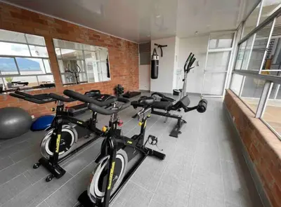 a gym with several bikes parked in a room at Piso13 Sabaneta, apartment, Parking, Pool & with club in the sky! in Sabaneta