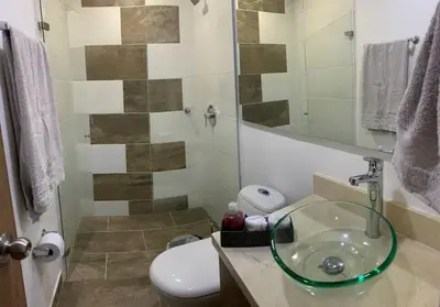 a bathroom with a sink and a toilet at Piso13 Sabaneta, apartment, Parking, Pool & with club in the sky! in Sabaneta