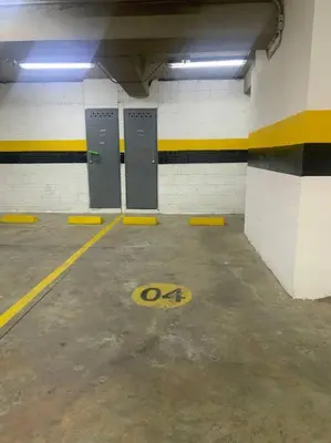 a parking garage with four stalls in a parking lot at Piso13 Sabaneta, apartment, Parking, Pool & with club in the sky! in Sabaneta
