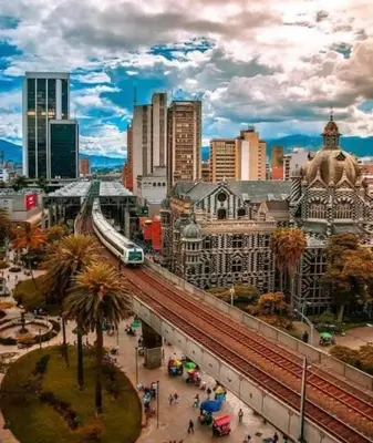 a view of a city with a train on a bridge at Piso13 Sabaneta, apartment, Parking, Pool & with club in the sky! in Sabaneta