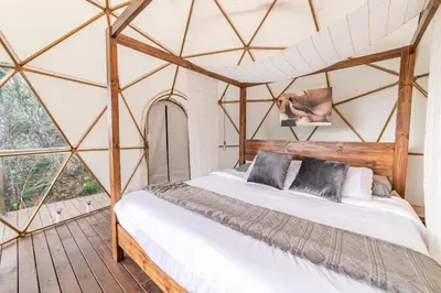 a bedroom with a bed in a tent at Cerro Verde Mirador in Medellín