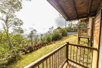 a balcony of a house with a view at Cerro Verde Mirador in Medellín