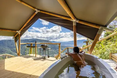 a person in a bath tub with a horse in it at Skyline Ecoliving Santa Elena in Santa Elena