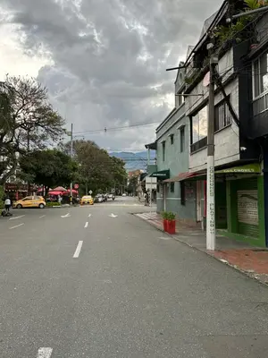 an empty street in a town with a building at Aparta estudio amoblado 2 Medellin, San joaquin in Medellín