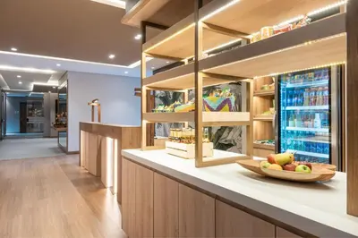 a kitchen with a bowl of fruit on a counter at Fairfield by Marriott Medellin Sabaneta in Medellín