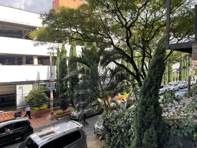 a view of a street with cars parked on the street at En Laureles con ascensor , balcón y muy bien ubicado en laureles Medellín , EL BARRIO MAS COOL DEL MUNDO in Medellín