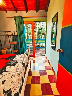 a bedroom with a bed and a checkered floor at Galilea in Santa Elena