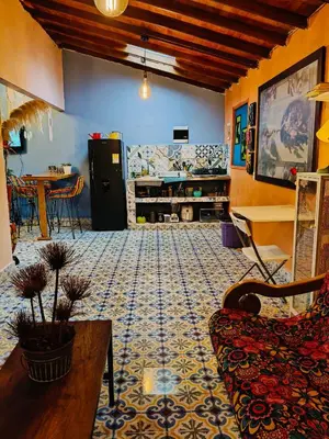 a living room with a couch and a table at Galilea in Santa Elena