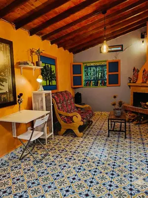 a living room with a couch and a table at Galilea in Santa Elena