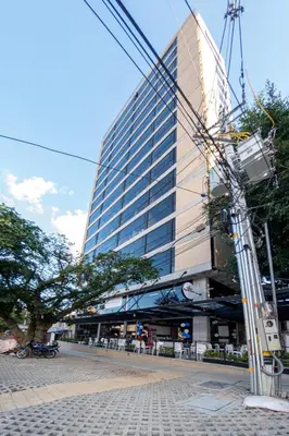 a tall building with a lot of windows on a street at Loft 43 in Medellín