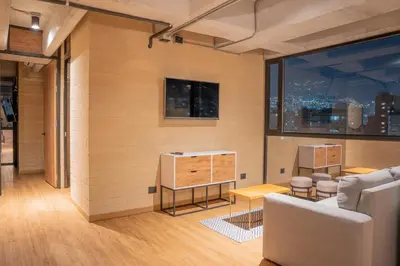 a living room with a couch and a table at Loft 43 in Medellín
