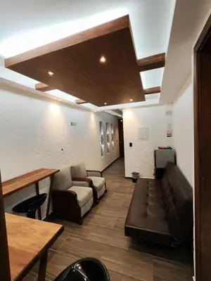 a living room with a couch and a table at Apartamento turístico jardín Antioquia in Jardin