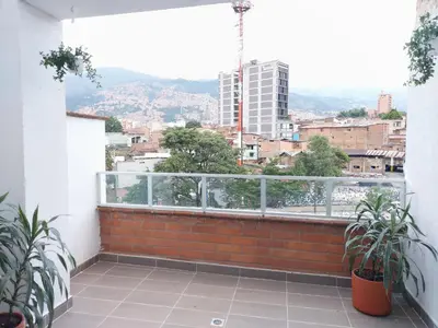 a balcony with a view of a city at P.H Downtown - Tranvía in Medellín