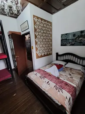 a bedroom with a bed in a room at Hostal Mirador Andino in Manizales