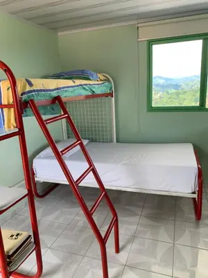 a room with two bunk beds and a window at Villa NiNa in Manizales