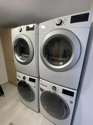 two washing machines are stacked next to each other at 80Cooliving Medellín in Medellín