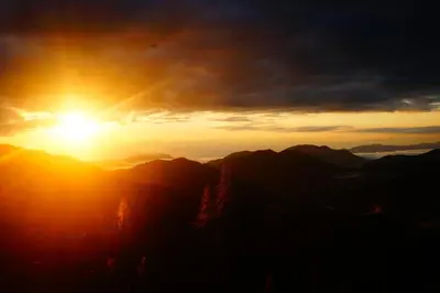 a sunset on the top of a mountain at Ecofinca Fuente Alegre in Cocorná