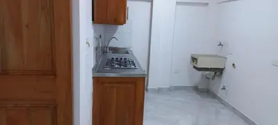 a kitchen with a stove and a counter top at Apartamentos con estacionamiento cerca al parque in Támesis